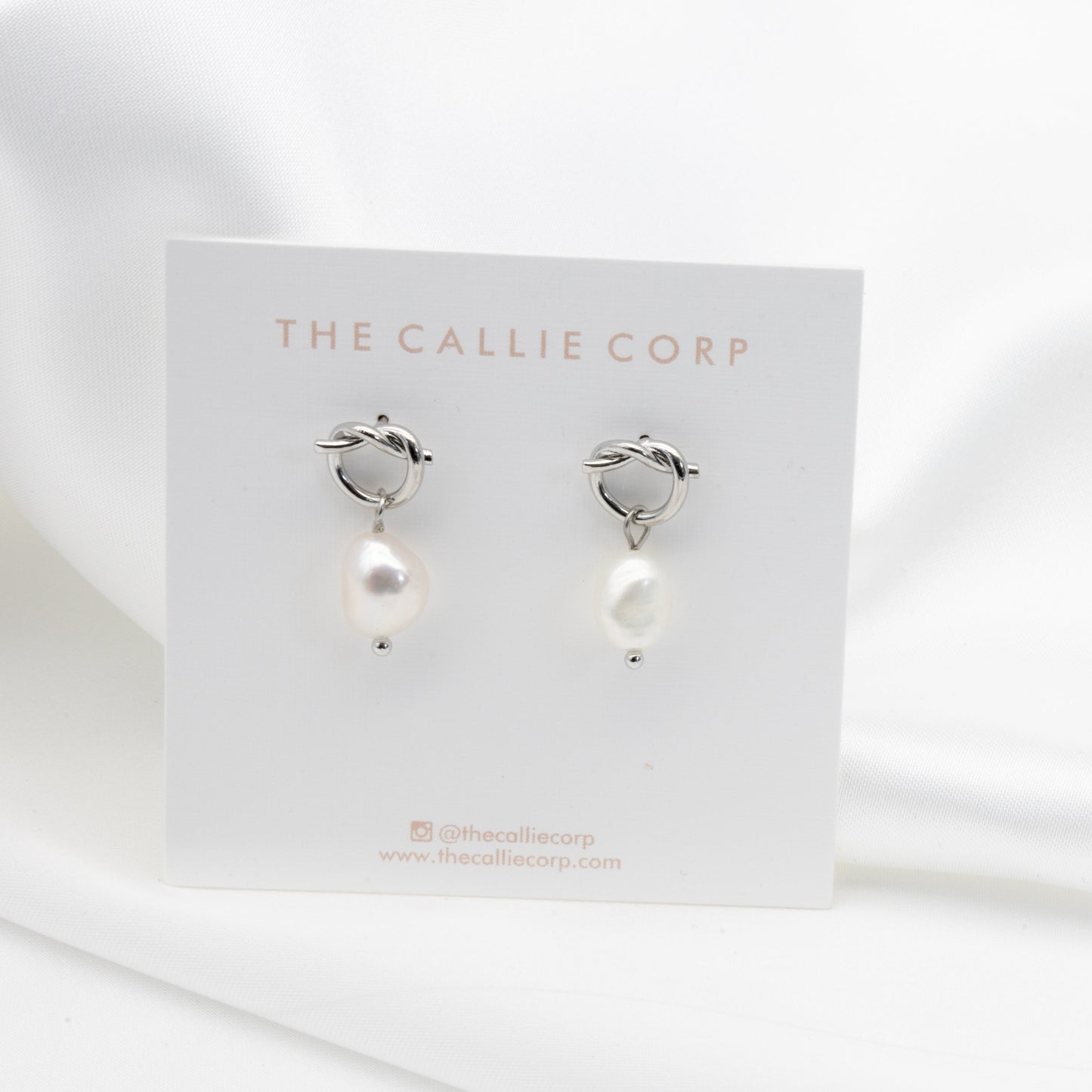 'Bowie' silver freshwater pearl earrings on a clean bridal jewellery background